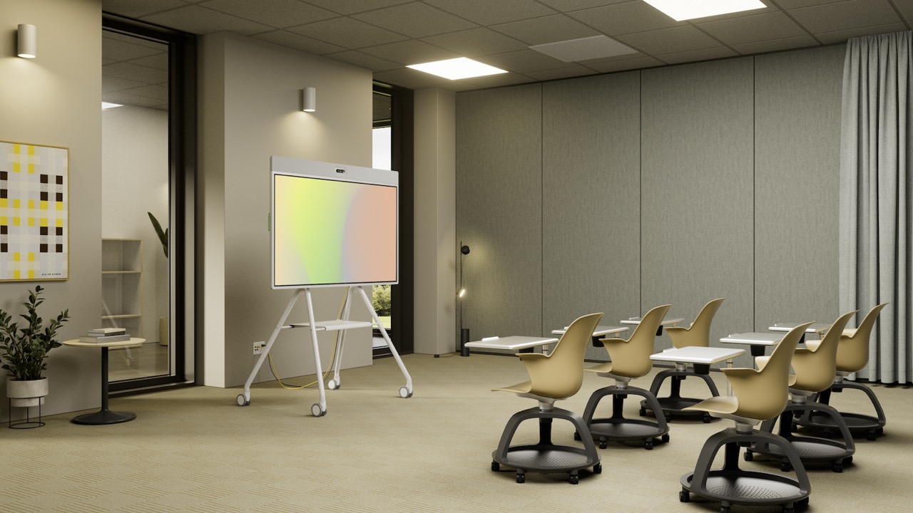 A training room with flexible mobile seating and a display on a mobile stand.