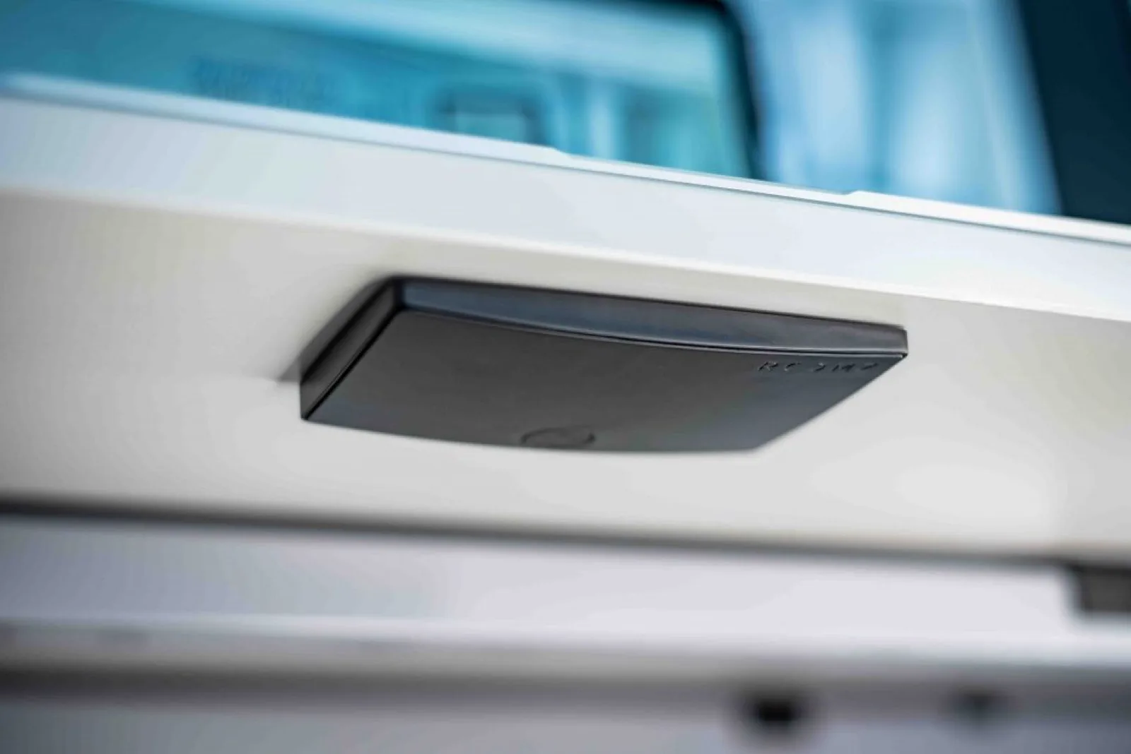 ROOMZ wireless desk occupancy sensor installed beneath a workstation